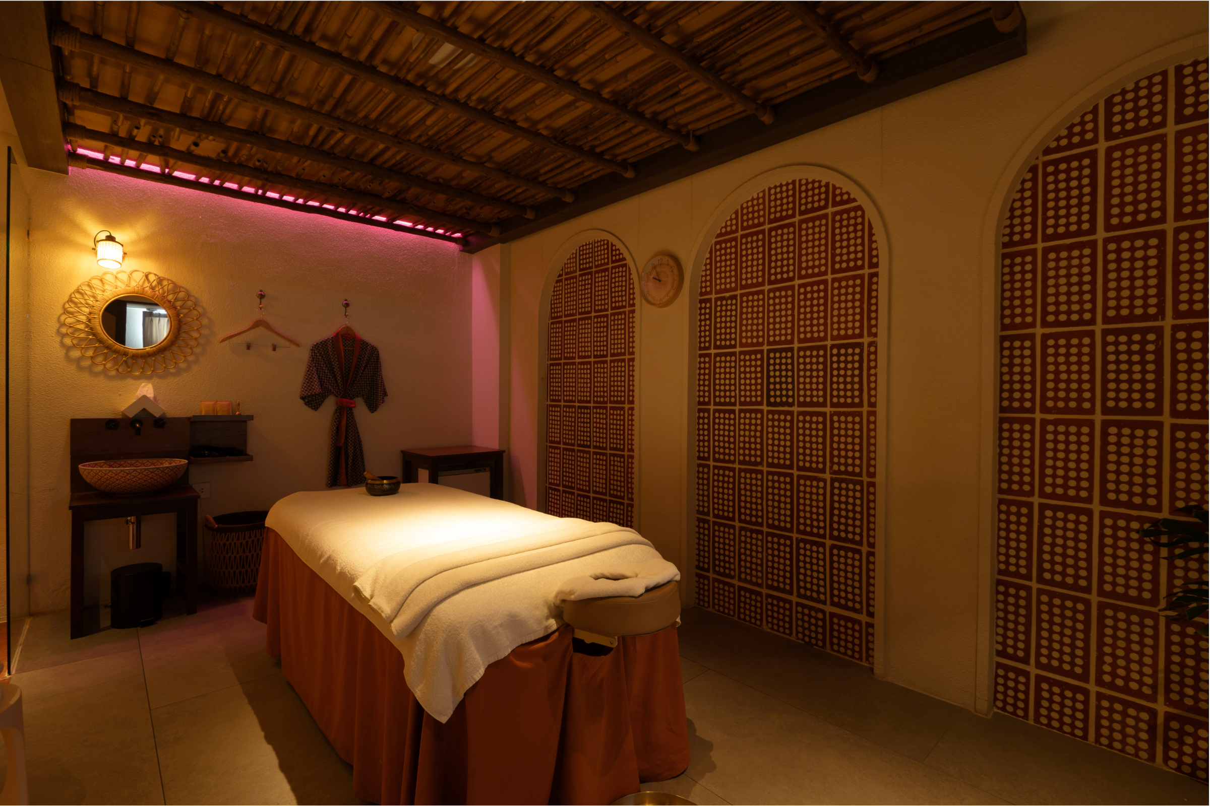 Beautifully designed treatment room with ambient lighting and premium furnishings